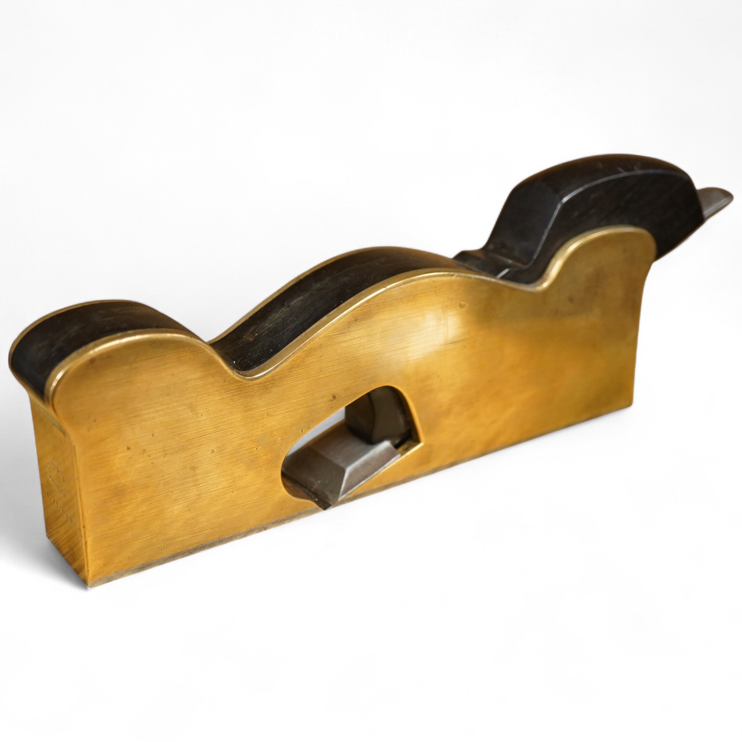 A Norris steel soled, gunmetal No.20E shoulder plane with ebony infill and wedge, 1 1/4”, stamped Norris, London and owner’s name beneath
